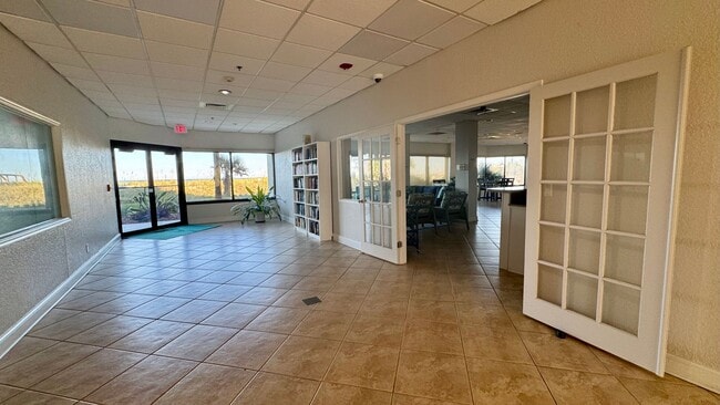 Building Photo - Furnished Beach Front Condo!! Enjoy Costal...