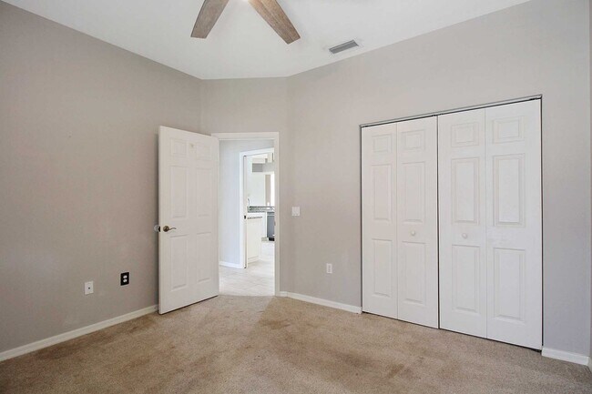 Building Photo - Annual rental: Spacious 3BR/2BA Creekwood Home with Office, Screened Lanai, EV Charger & Resort-S...