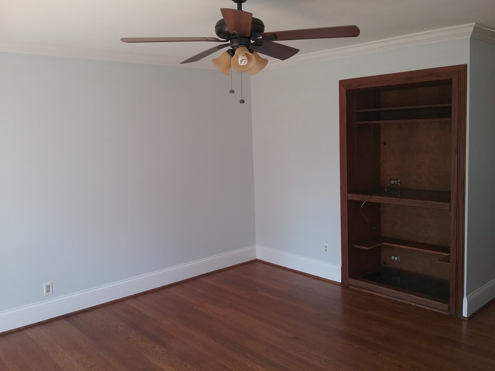 spacious living room with built-in for TV and entertainment system - 701 Rosalyn Dr