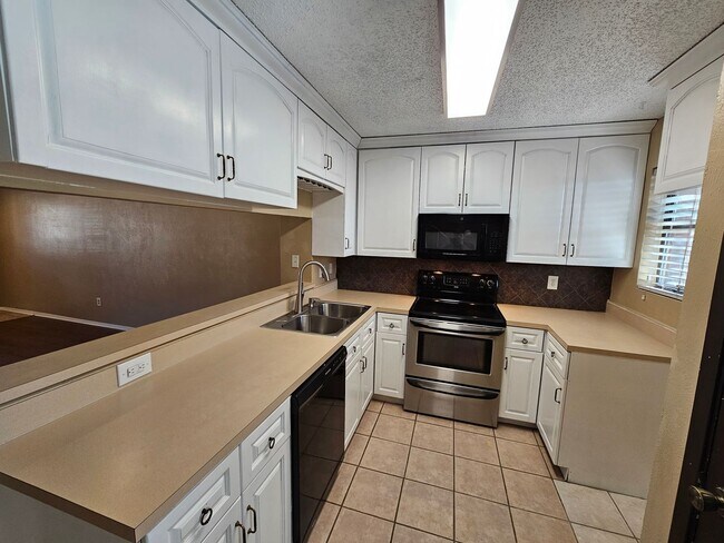 Building Photo - Stunning two-level, two-bedroom, one-and-a-half-bathroom townhome