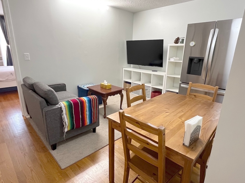 Dining/living area w/ 55in smart TV - 33 Pond Ave
