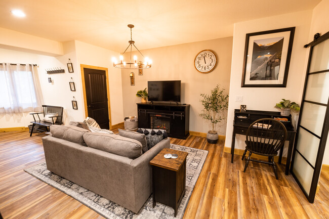 Living Room with workspace and hall closet - 4125 Walker Rd