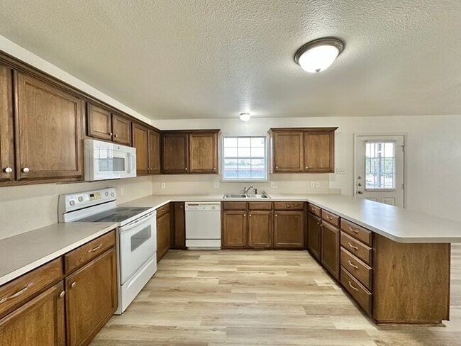Building Photo - Newly Updated 3BR/2BA Corner Duplex in Lindale ISD! Fenced Yard & 1 Car Garage!