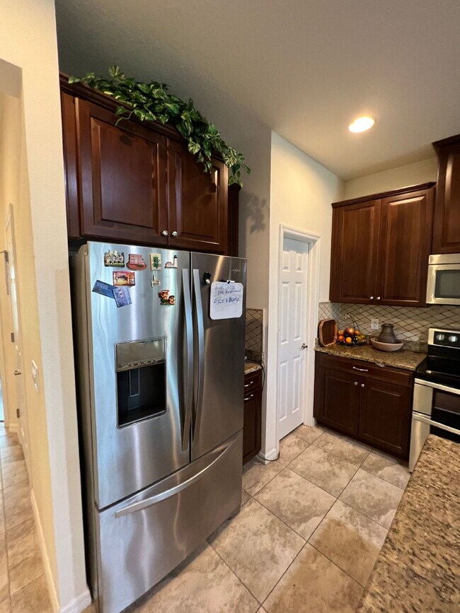 Building Photo - "Spacious 4-Bedroom Lutz Home with Elegant...