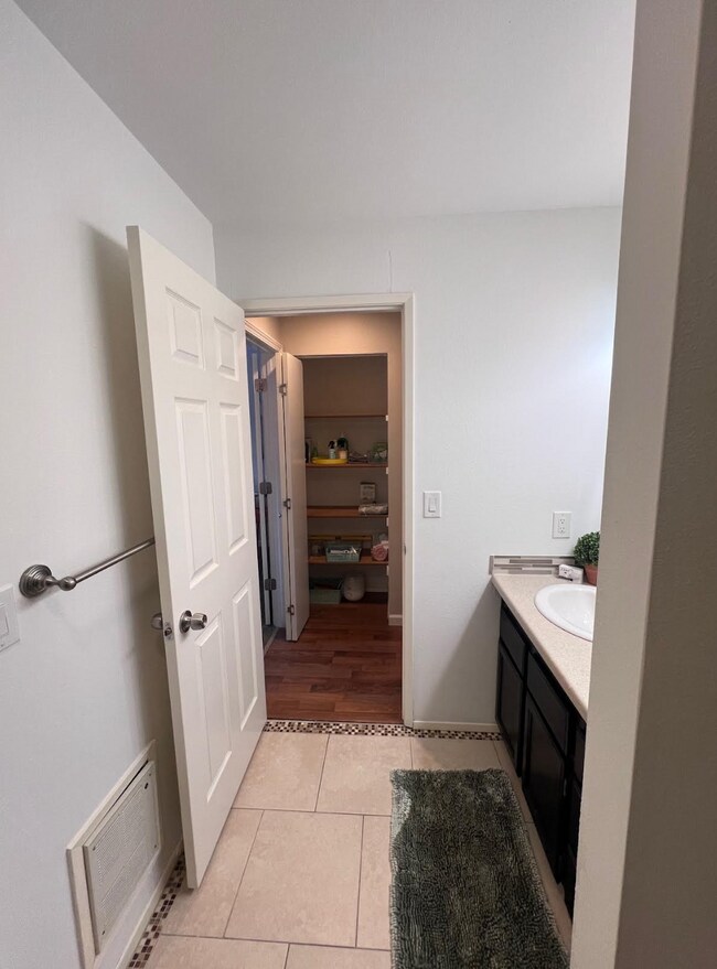 Bathroom looking into hallway linen closet - 1881 E Tudor Rd