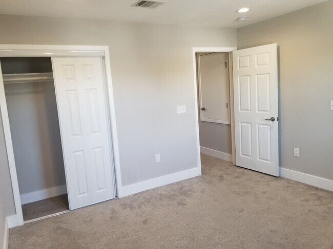 Bedroom 2 is off a private hallway upstairs. - 935 La Posada Dr