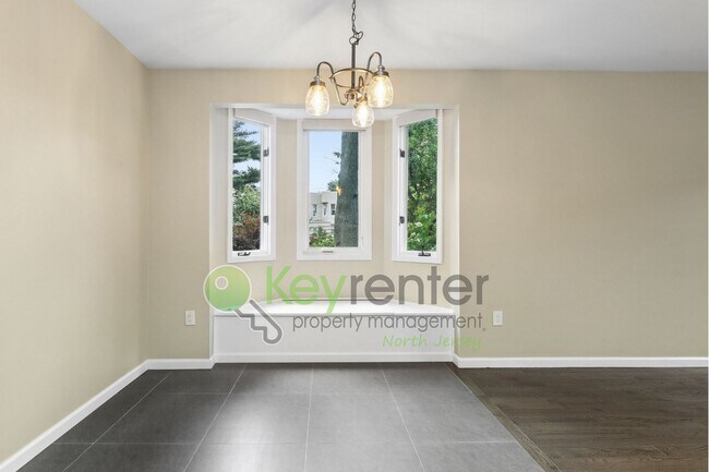 Building Photo - Spacious 2BR/2BA Duplex in Gated Community with Parking, Washer/Dryer & NYC Skyline Views