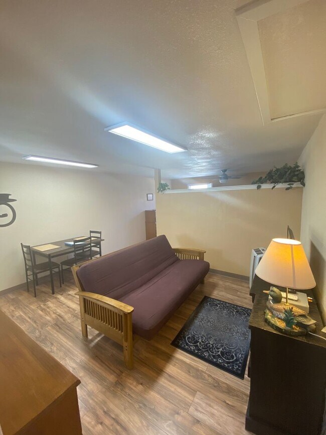 Building Photo - Adorable studio with large garage and work...