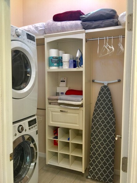 Laundry room with full sized stackable washer/dryer - 1348 S Curson Ave