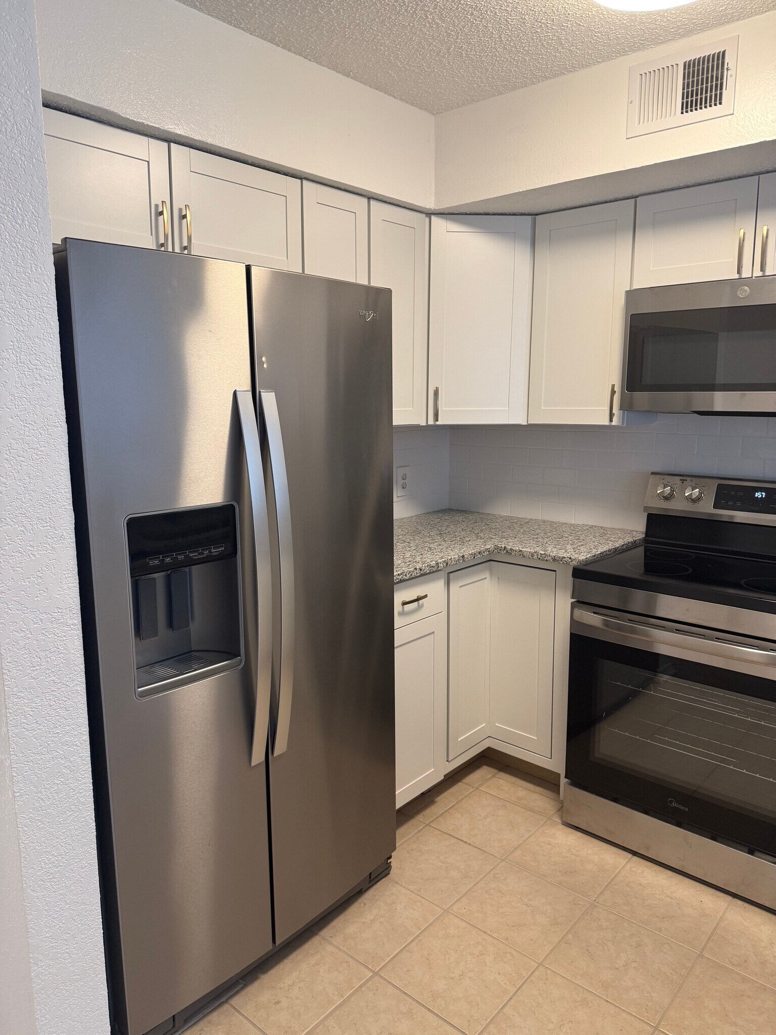 New kitchen cabinets with full use of corner cabinets. - 2301 Basil Dr