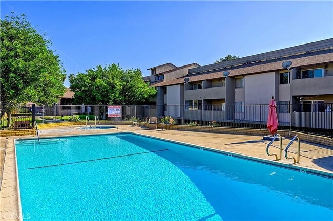 Building Photo - "Chic 1-Bed Retreat with Pool & Central Vacuum in Anaheim's Heart – 710 Sq Ft of Hardwood Elegance!"