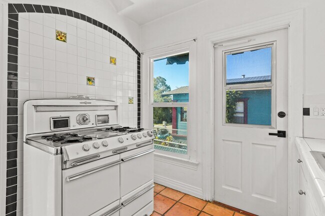 Building Photo - Move In Special!!  Elevated Golden Hill 2BR with Southwesterly Views with A/C & Detached Garage