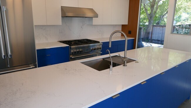 Building Photo - BEAUTIFUL UPDATED FOUR BED / TWO BATH PLUS OFFICE EICHLER HOME WITH GREAT OUTDOOR SPACE