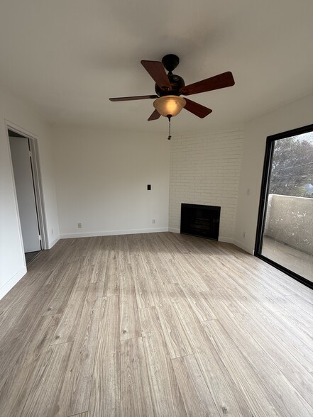 2nd bedroom upstairs with faux fireplace & balcony - 10330 Riverside Dr