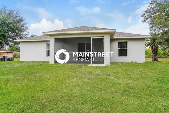 Building Photo - 3 Bedroom Pet-Friendly Home in lehigh acres, FL with Main Street Renewal