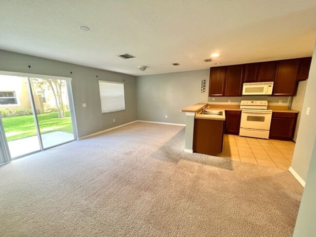 Building Photo - AVAILABLE NOW! Charming 2 Beds 2.5 Bath Townhome! 2 MASTER SUITES! Attached one car garage!! Extr...