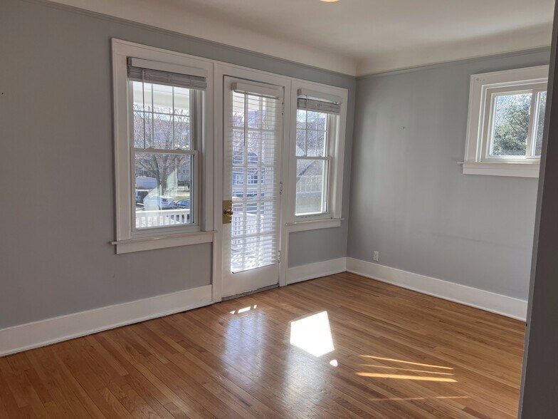 Living room with door to deck. - 210 S Laurel St