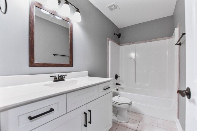 Building Photo - Pet Friendly Three Bedroom with Bonus!