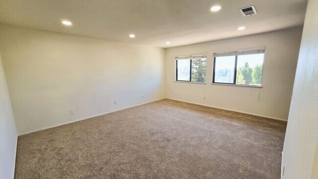 Building Photo - "Spacious, Sunlit Home in a Peaceful Ranch...