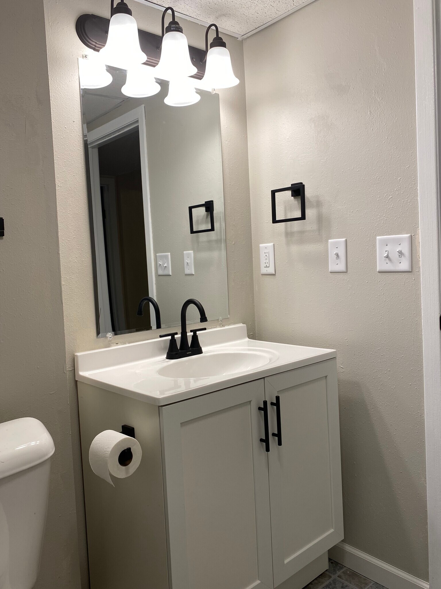 Downstairs bathroom is clean and simple. - 225 6th St SE