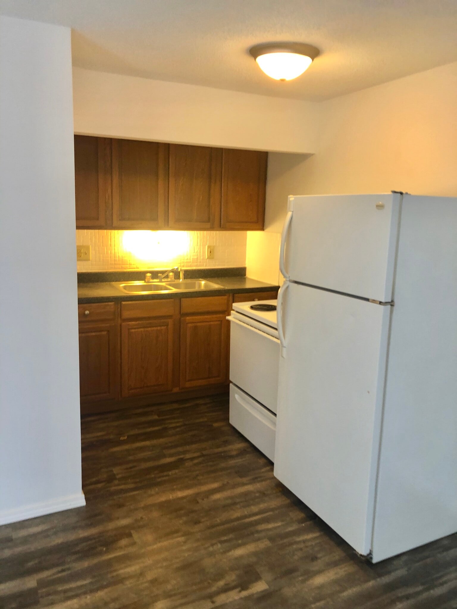 Kitchen includes refrigerator and range. - 1026 Danwood Ln