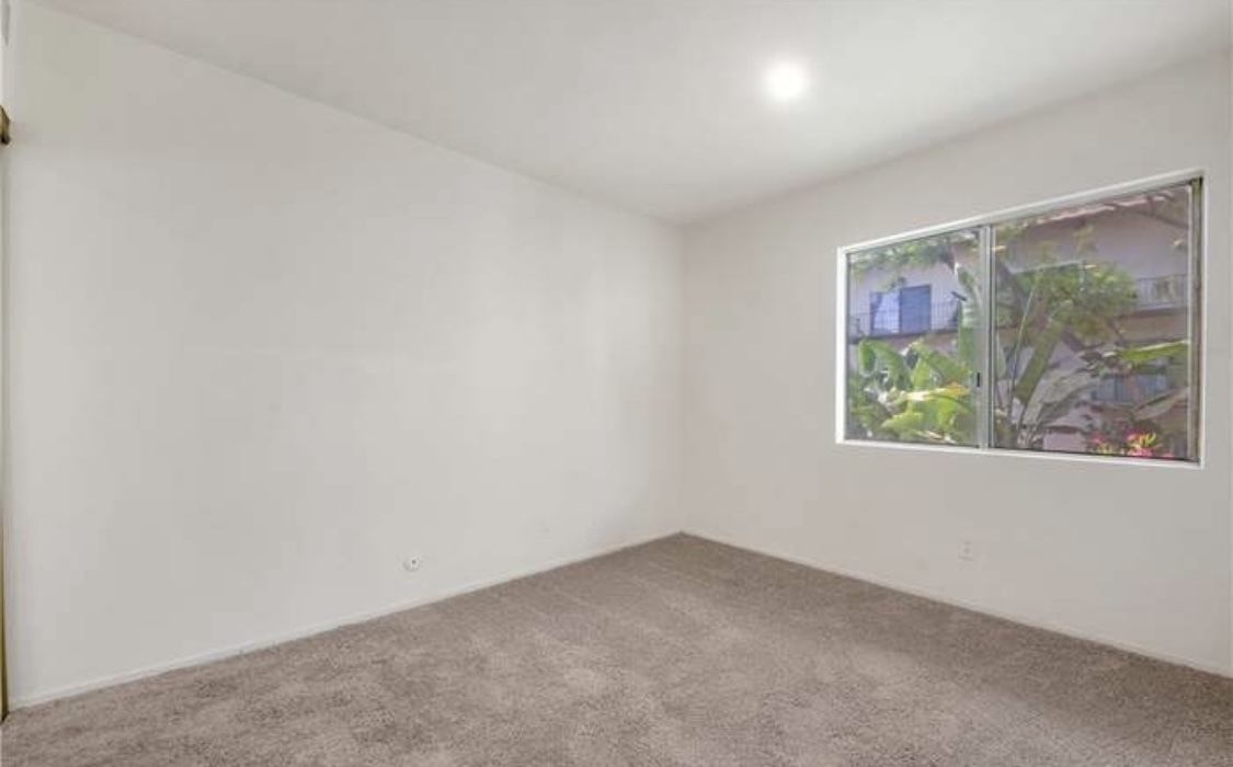 Replaced the carpet with wood vinyl floor - 5460 White Oak Ave