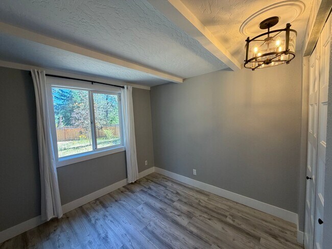 Building Photo - Spacious 4BR/3BA Home with Deck, Fenced Yard & Garage