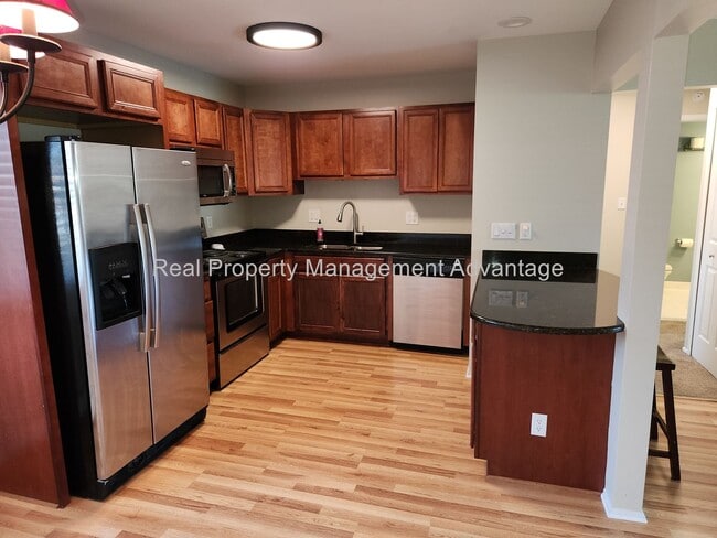 Building Photo - Spacious, Updated Condominium with Two Ful...