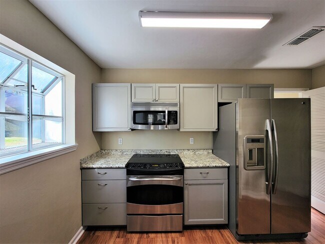 Building Photo - 2 bedroom duplex for rent right away off E Mahan, wood floors and fireplace for $1450 per month