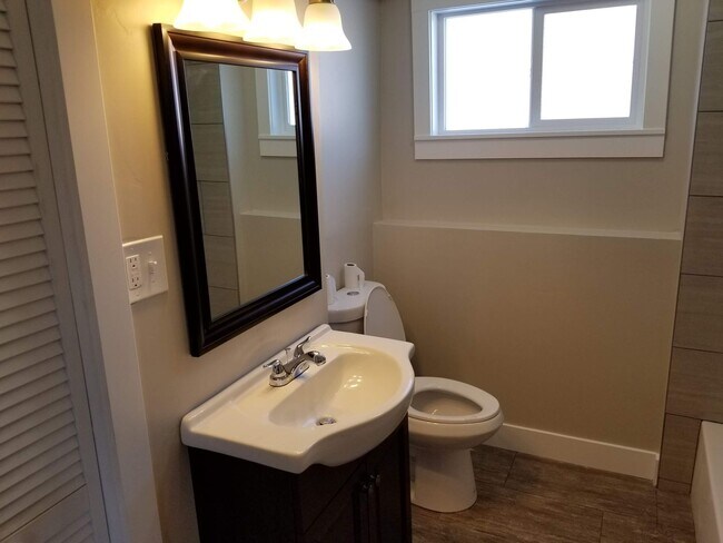 Building Photo - Spacious 5-Bedroom Magna Home with Deck and Ample Parking