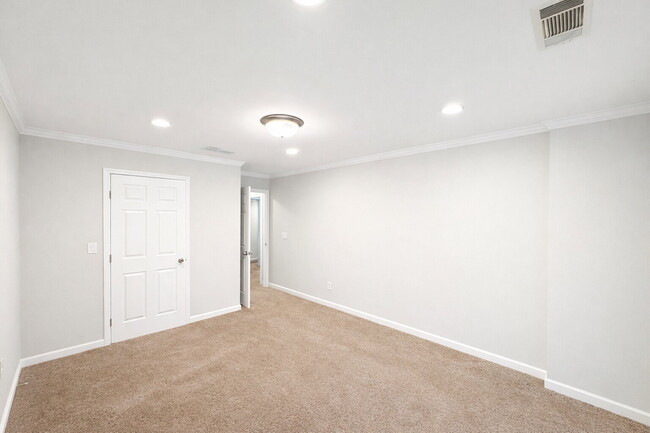 Building Photo - Gated Johns Creek Townhome Offering Space, Privacy, and Everyday Convenience