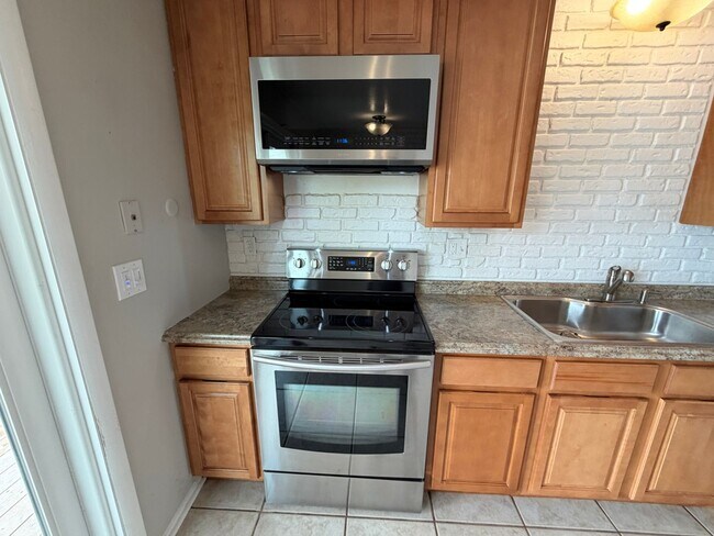 Building Photo - 4-Bed Home Near Clement Park with Entertainer’s Basement & Outdoor Oasis