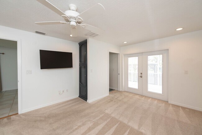Building Photo - Live the ultimate Space Coast waterfront lifestyle at this stunning beachside canal home in Satel...