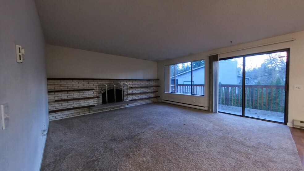 Empty Living room and deck - 6125 NE 193rd Place