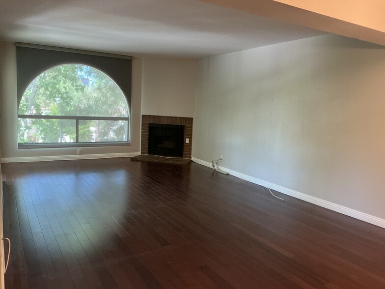 Fireplace, wood flooring - 21650 Burbank Blvd