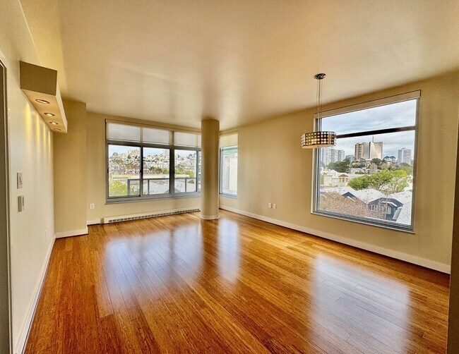 Building Photo - Corner Light. City Energy. Zero Compromise.