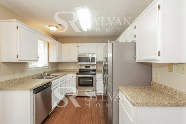 Building Photo - The living is easy in this 3 bedroom, 2 bathroom home