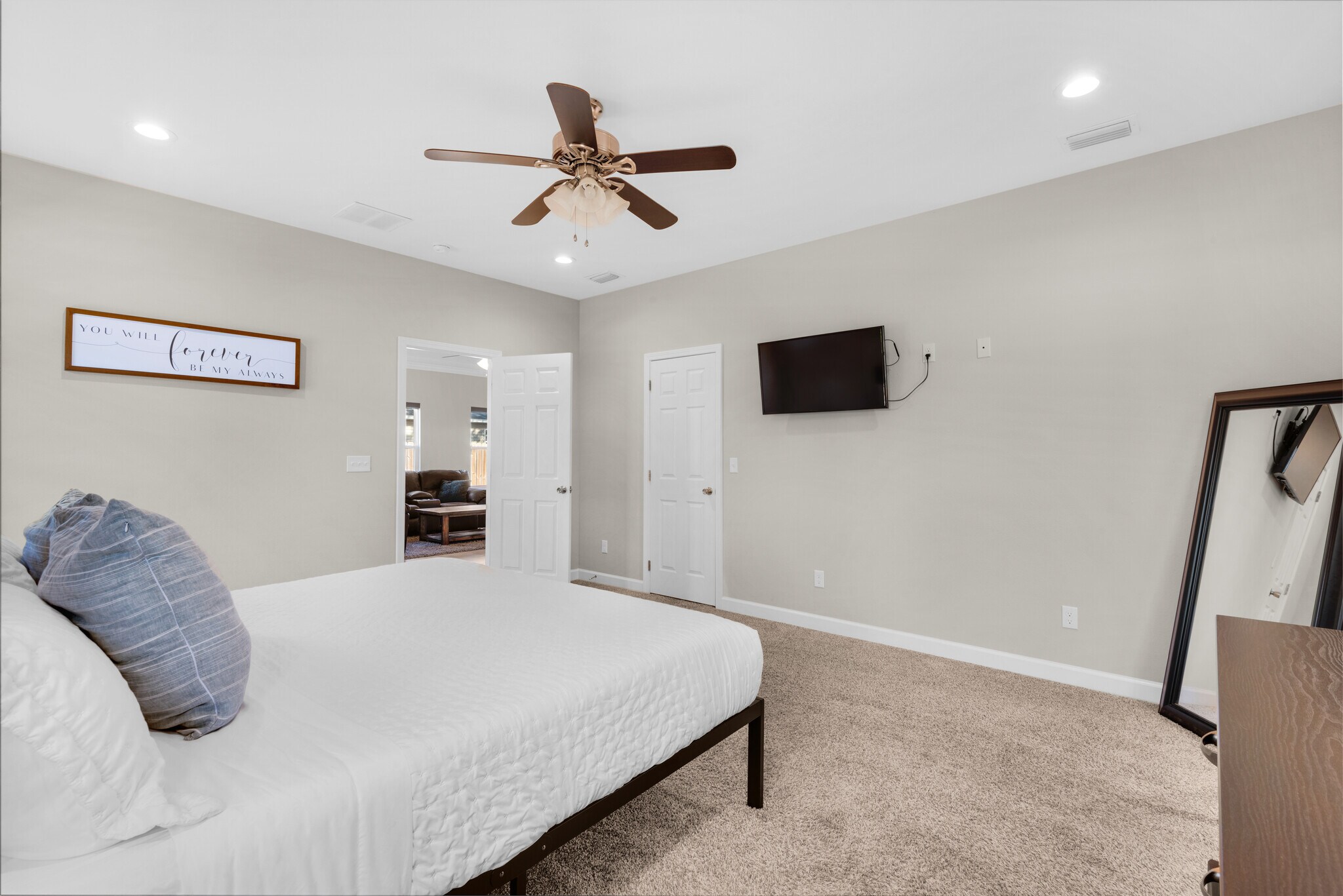 Master bedroom with cozy memory foam king bed, fresh linens, dressers, nightstands, and TV - 28 Snook Rd