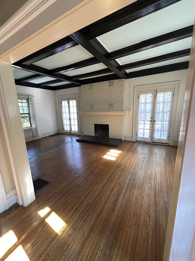 Living room with French doors going out to front porch. - 1048 28th St S