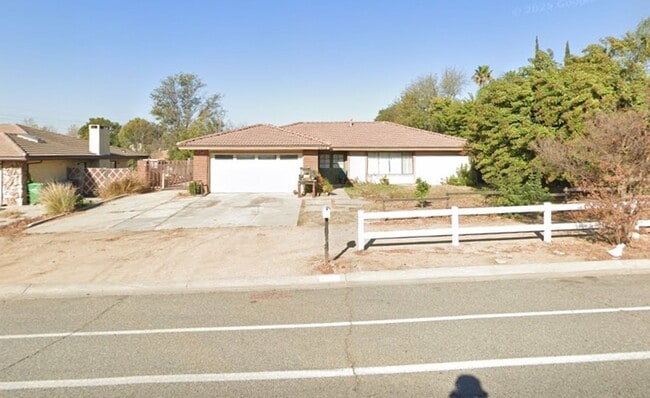 Primary Photo - This property is a 3 bedroom, 2 bathroom home featuring an open floor plan with tile throughout. ...