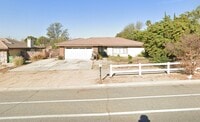 Building Photo - This property is a 3 bedroom, 2 bathroom home featuring an open floor plan with tile throughout. ...