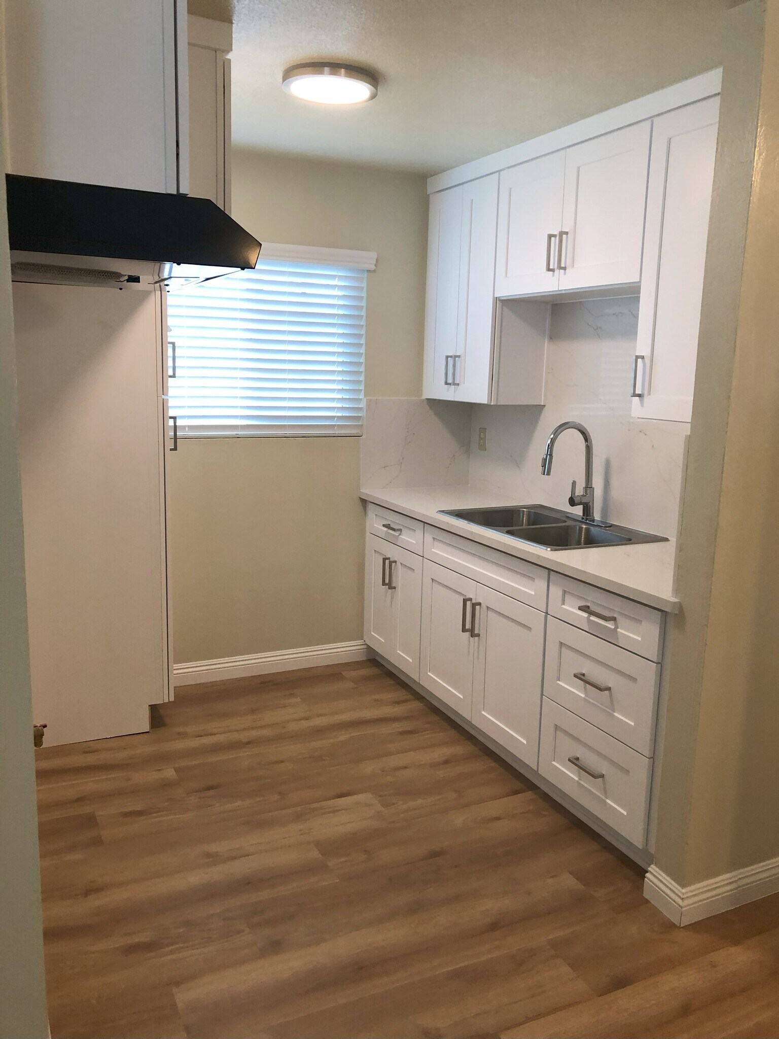 Kitchen cabinetry is new with plenty of room for dishes, pots and pans . - 9226 Palm St