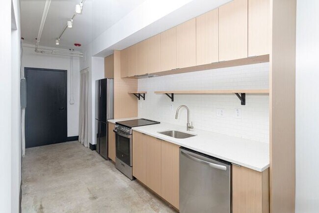 Building Photo - Check out this studio ! We want you to cal...