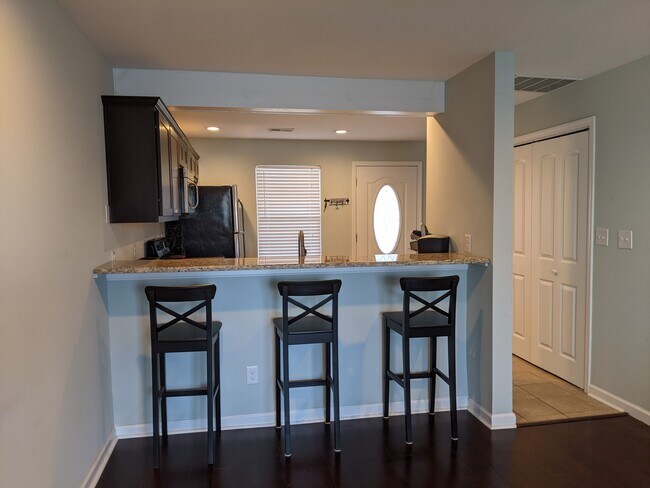 Sit at the bar or use the dining area conveniently open to the kitchen. - 2414 Lake Park Rd