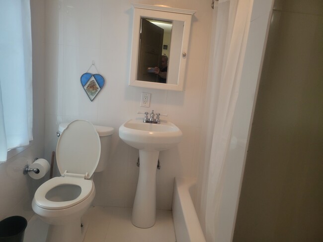 white porceliane bath room with tub - 3600 N Bay Homes Dr