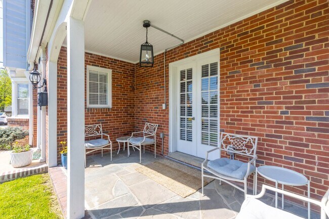 Building Photo - Luxurious Brick Colonial in Prestigious Gu...