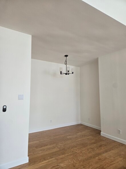 Dining area with new chandelier - 64 Forest St
