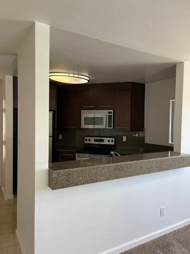 Building Photo - Upgraded upstairs corner unit in the Verano Complex