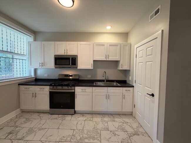 Building Photo - 7823 S Colfax Ave