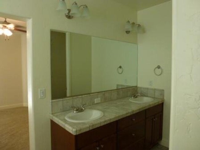 Building Photo - 4 Bedroom home in gated community + most u...